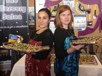 Rochelle Diver (IITC) and Emily Boone (IPEN) serve tuna fish snacks to raise awareness about high mercury levels in fish.
