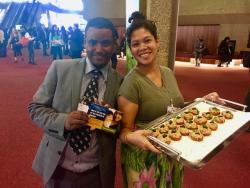 Tadesse Amera (PAN-Ethiopia) and Tiffany Tool (IPEN) serve tuna fish snacks at Mercury Treaty COP1.