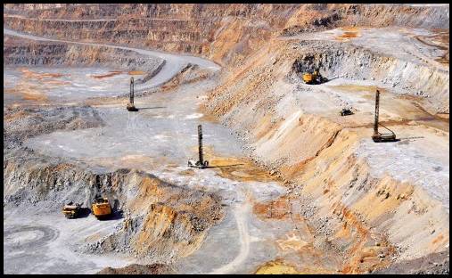 Dexing is Asia’s largest open pit copper mine – note the full sized digger machines and dump truck