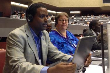 Tadesse Amera (Pesticide Action Nexus Ethiopia) giving intervention with Pamela Miller (Alaska Community Action on Toxics) listening