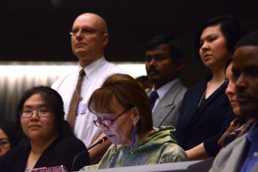 Vi Waghiyi giving intervention with Tiffany Immingan to her right and IPENers standing behind in solidarity